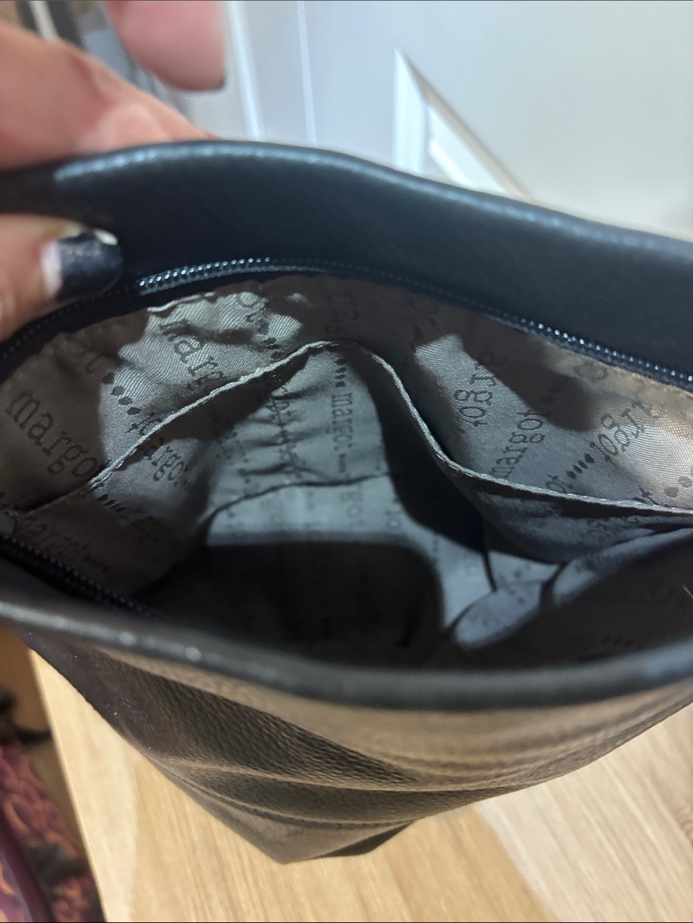 Black Leather Crossbody Bag with Silver Ring Details - Picture 9 of 15